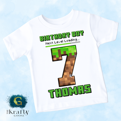 A white t-shirt with a Minecraft-themed design, featuring the text "Birthday Boy 7 Thomas" and a Minecraft-style number 7.