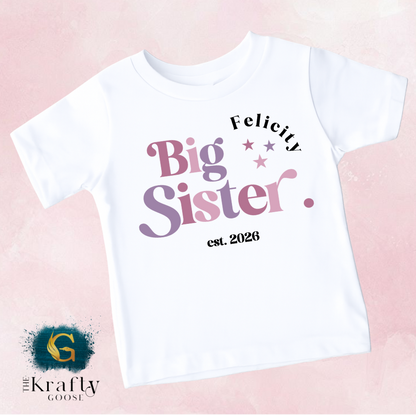 A white t-shirt with text and graphics printed on it.