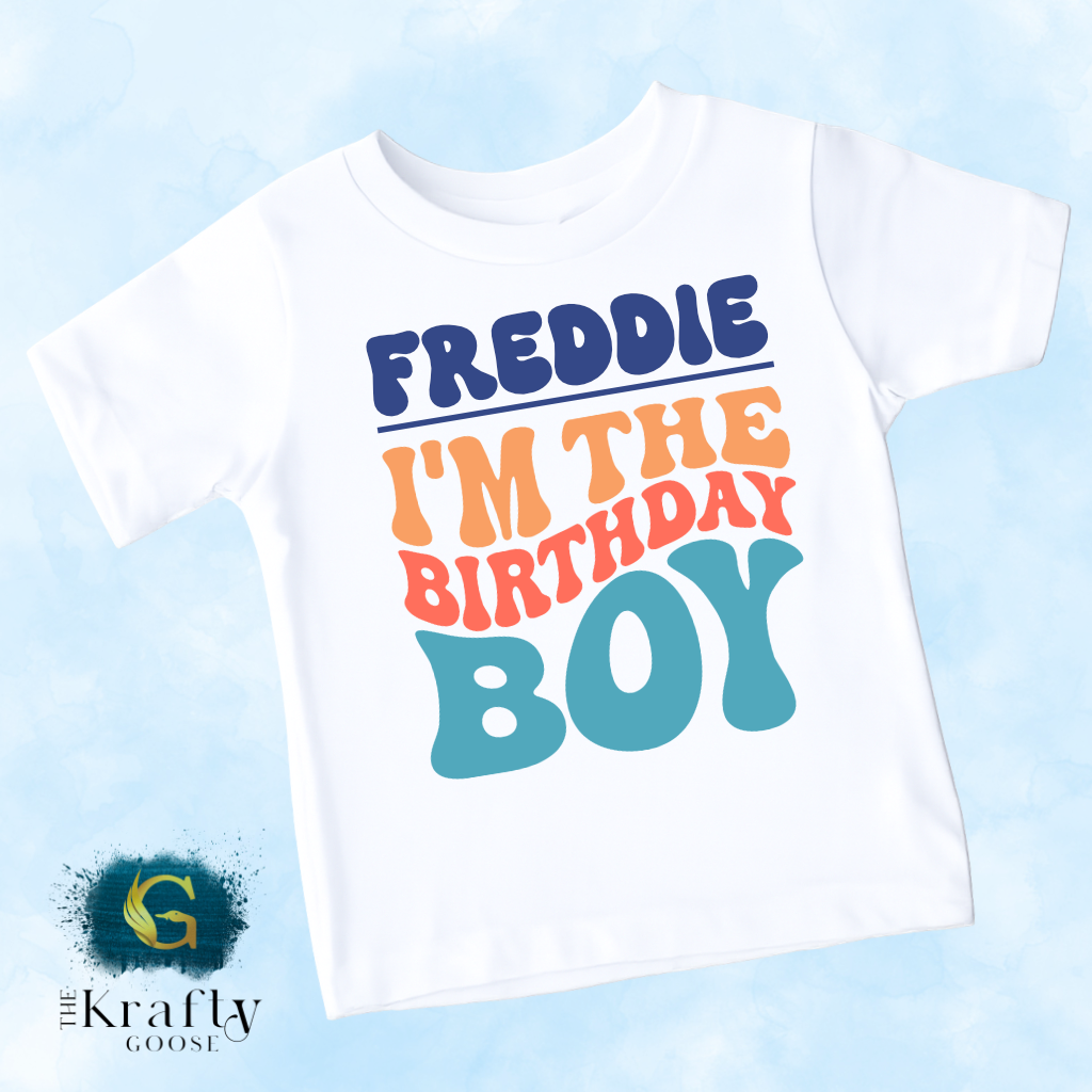 A white t-shirt with a colorful text design that says "FREDDIE I'M THE BIRTHDAY BOY".