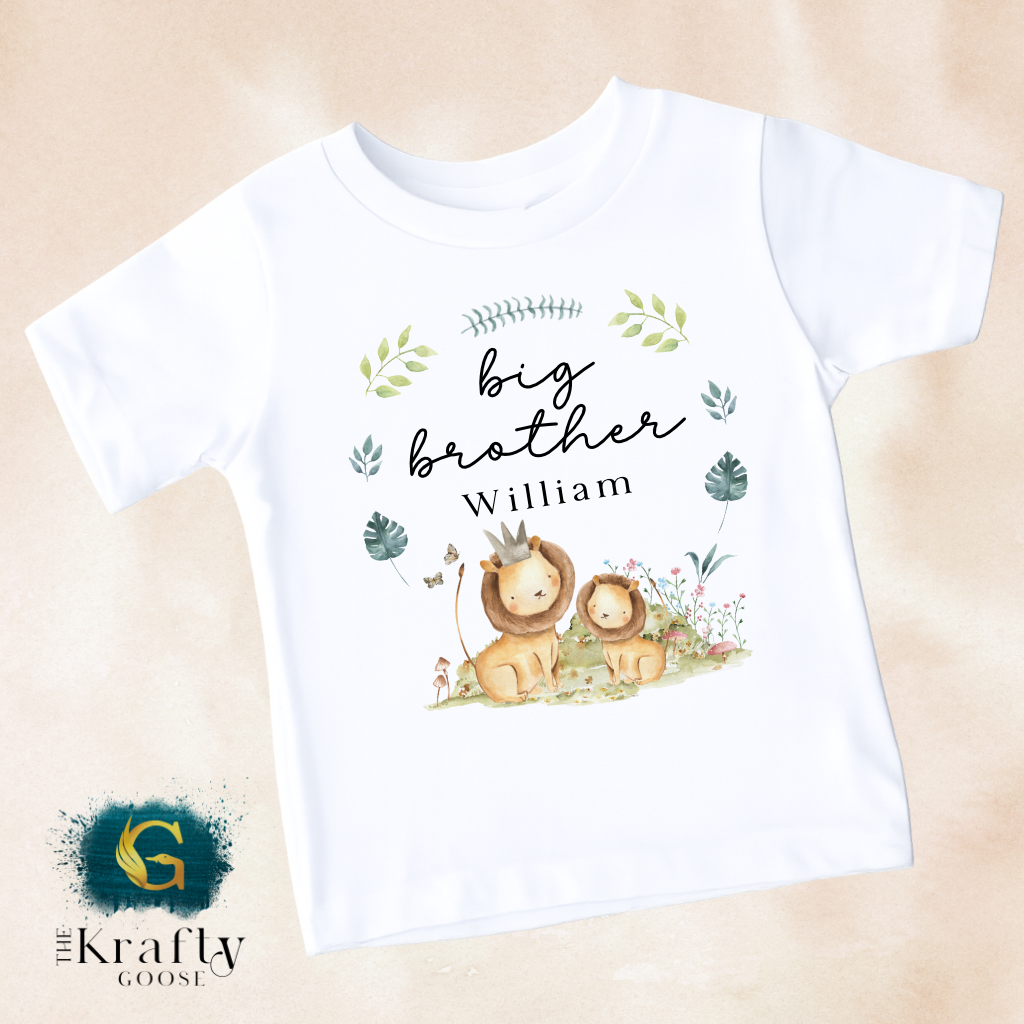 A white t-shirt with a printed design featuring two lions and the text "Big brother William" along with some decorative elements.